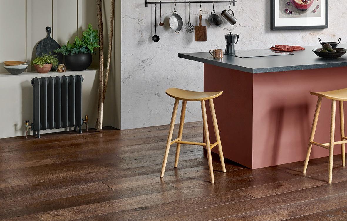 Modern wooden bar stools with light-toned engineered oak finish and minimalist design for cosy home interiors