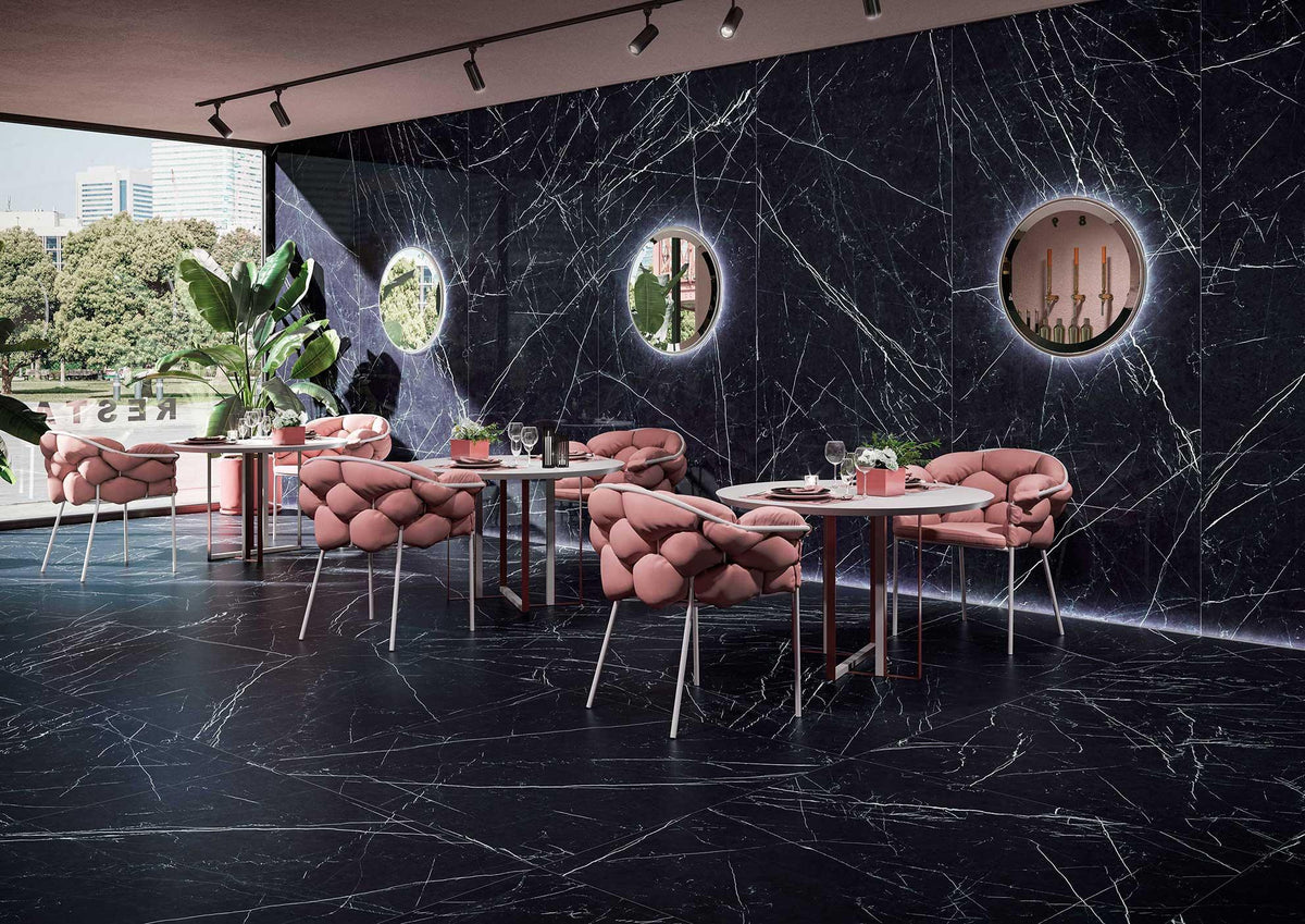 Pink tufted velvet chairs with slender metal legs complement modern wall panels for luxury interior updates