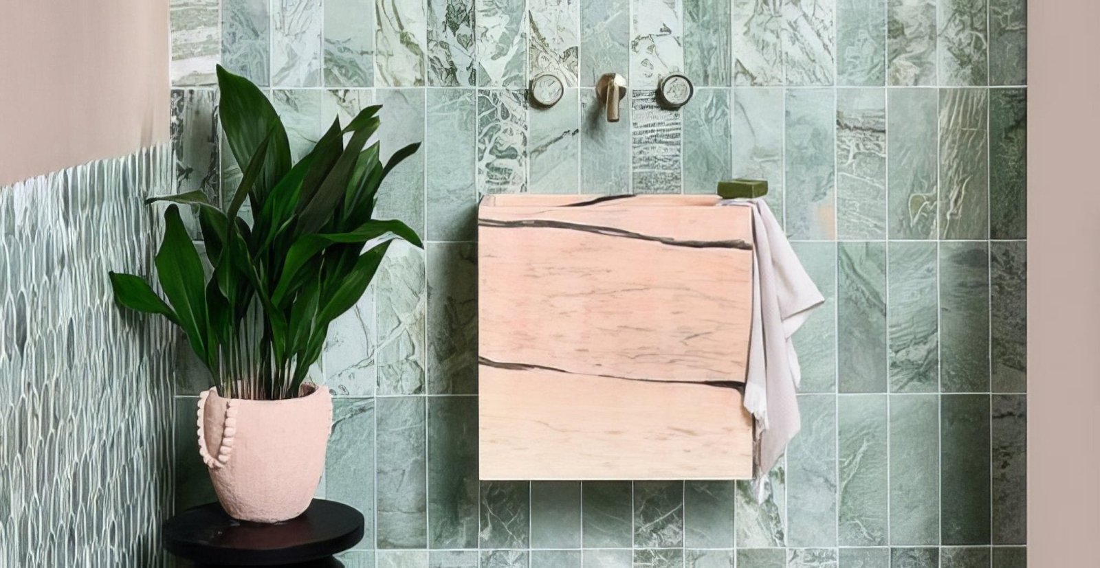 A blush pink marble textured wall mounted vanity with minimalist design and two horizontal seams for small bathrooms