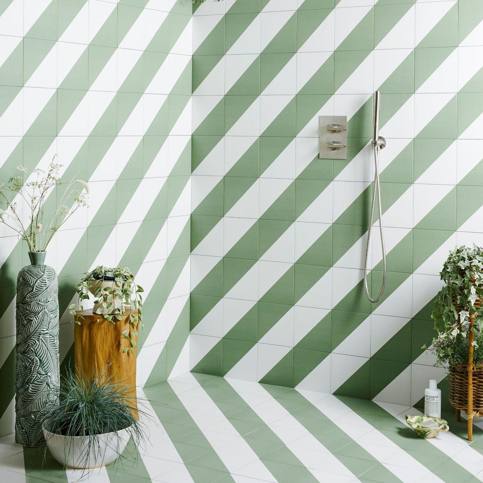 Green and white diagonal-striped ceramic floor and wall tiles commonly used in bathroom interiors