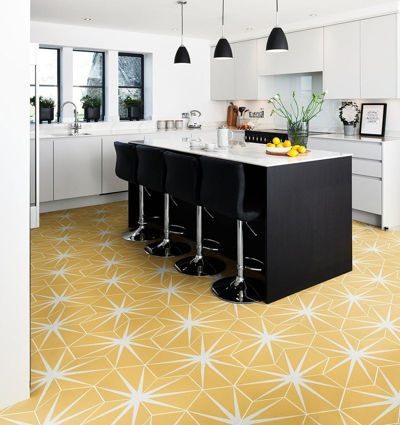 Yellow starburst-patterned indoor outdoor tiles with white geometric accents ideal for versatile living spaces
