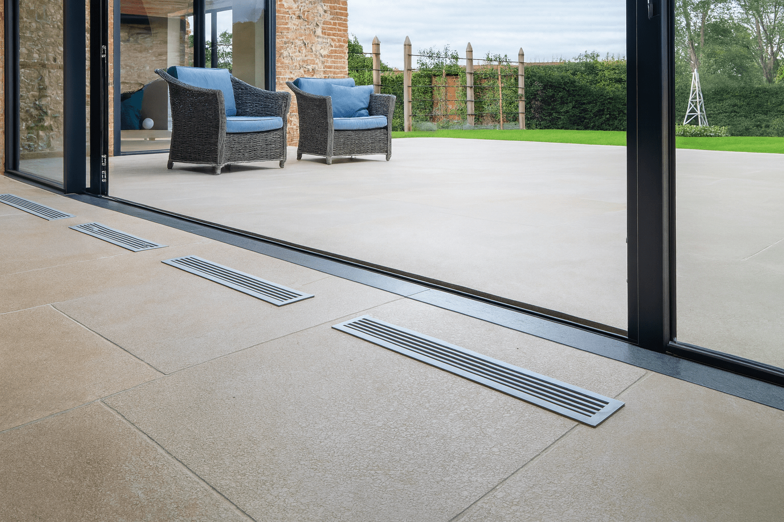 Silver metallic floor vents with sleek modern design featured in flagstone floor tiles collection