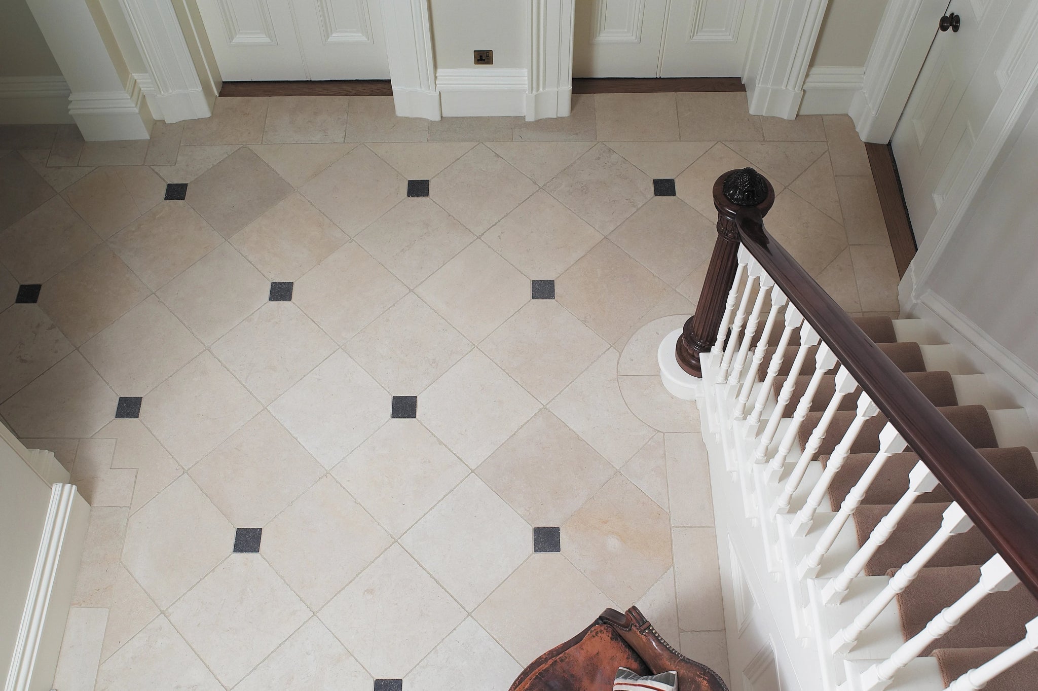 Beige and black diamond-patterned polished marble floor tiles from the limestone tiles collection