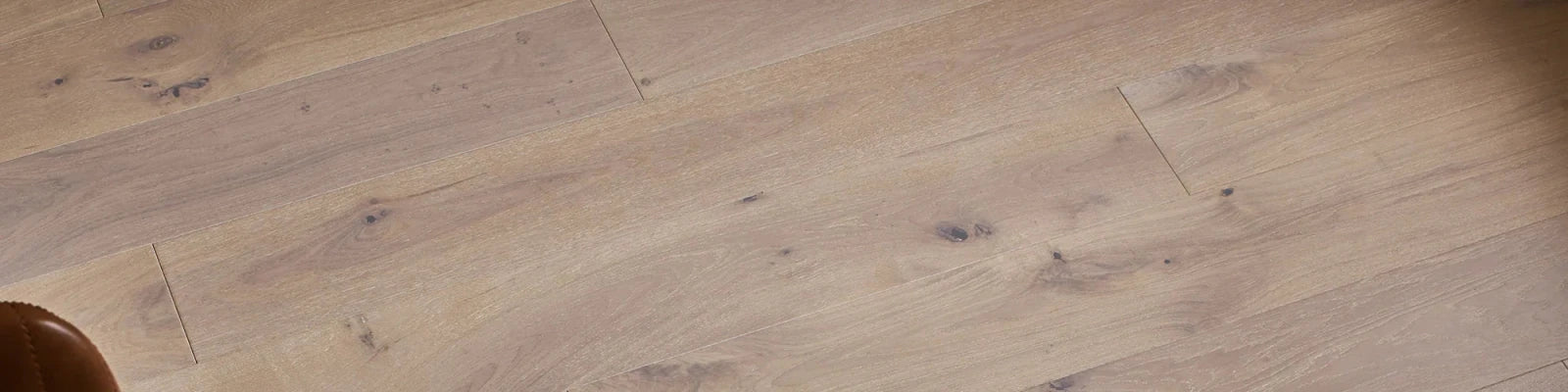 Light-colored woodpecker stonehaven engineered oak flooring planks with natural grain and subtle knots