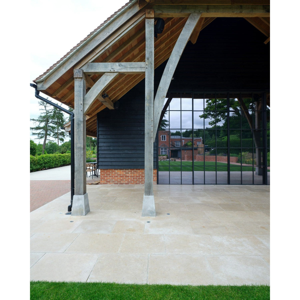 Wychwood Limestone Tumbled & Etched paving on a barn terrace