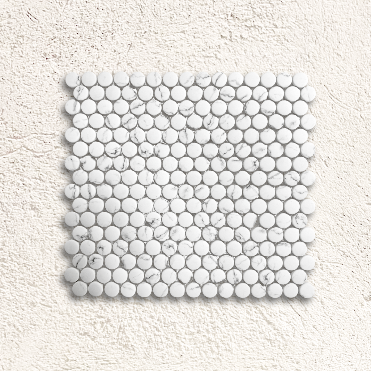 White marble mosaic tile with round glossy pieces in a grid pattern from Ritz Statuario round mosaic collection