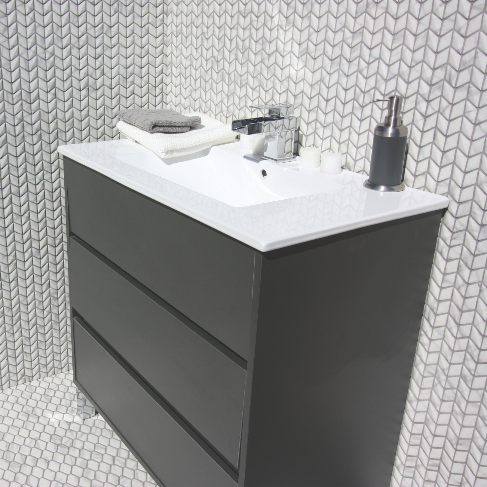 Ritz Carrara Diamond Chevron Mosaic marble tiles styled in a bathroom