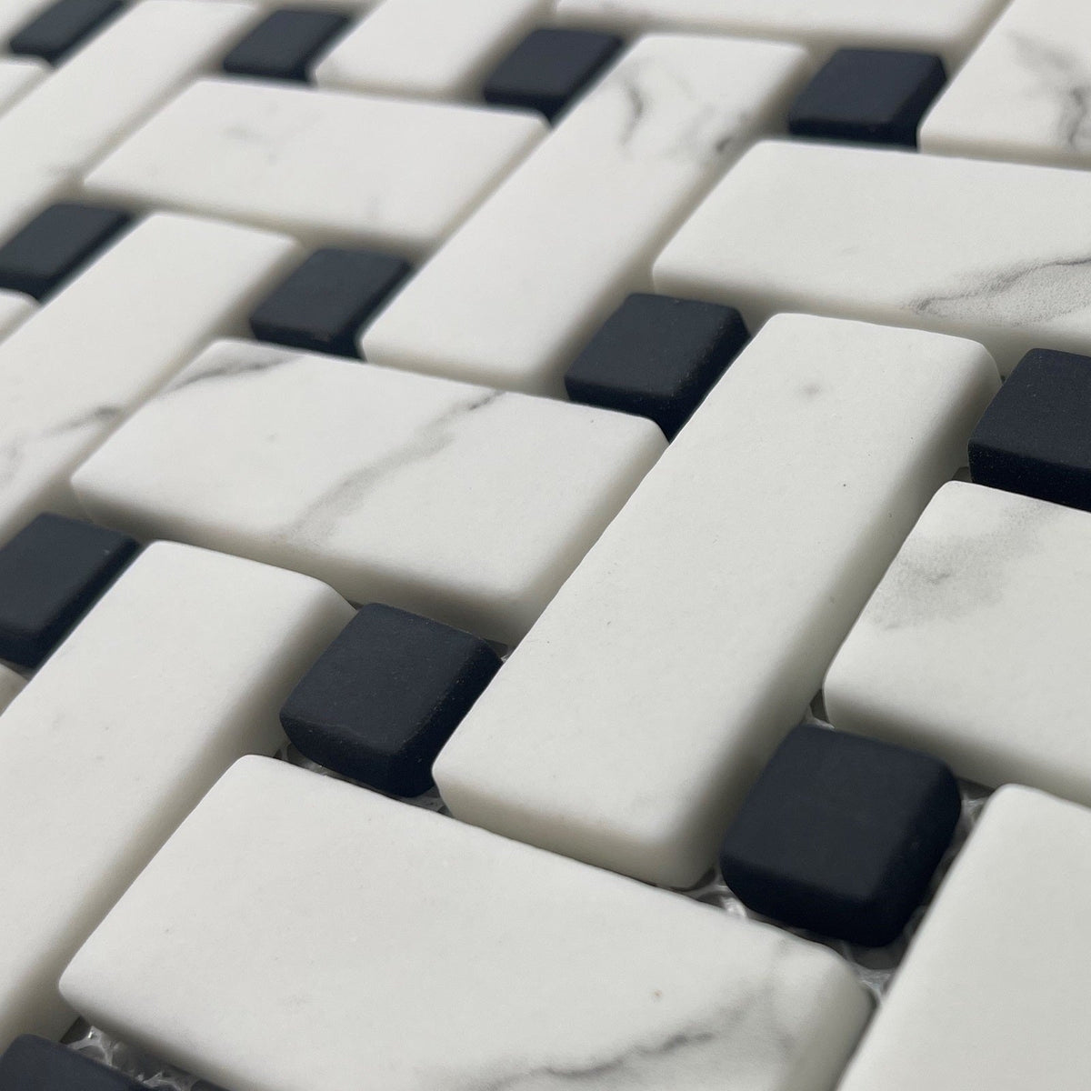 Ritz Carrara Black Basketweave mosaic with white marble and black tiles in a woven basketweave pattern