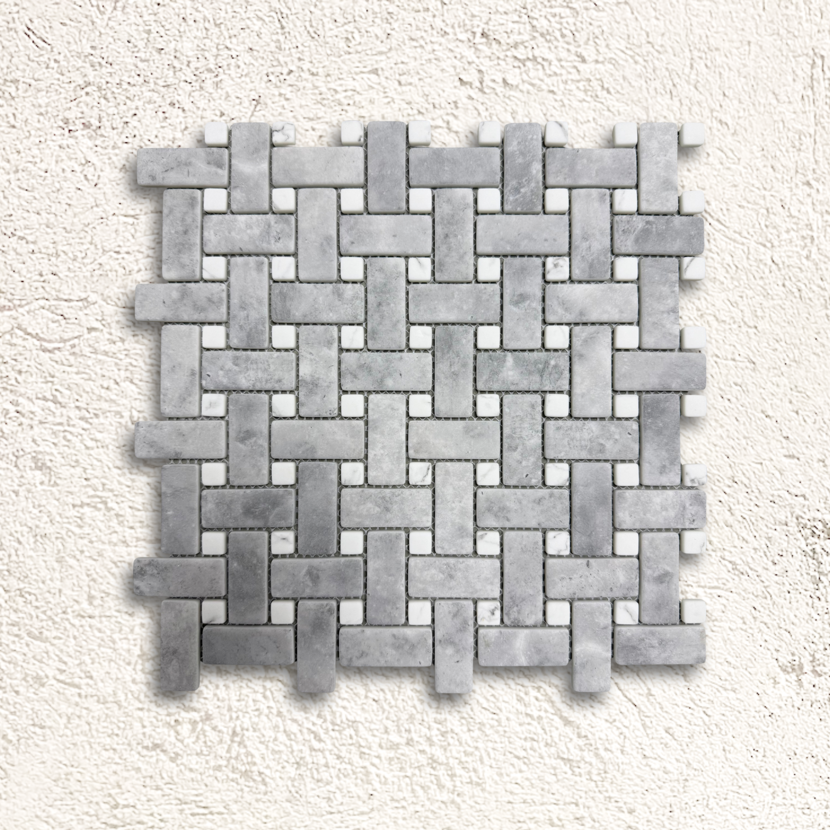 Ritz Grey Marble Carrara basketweave mosaic tile featuring gray marble with small white square accents