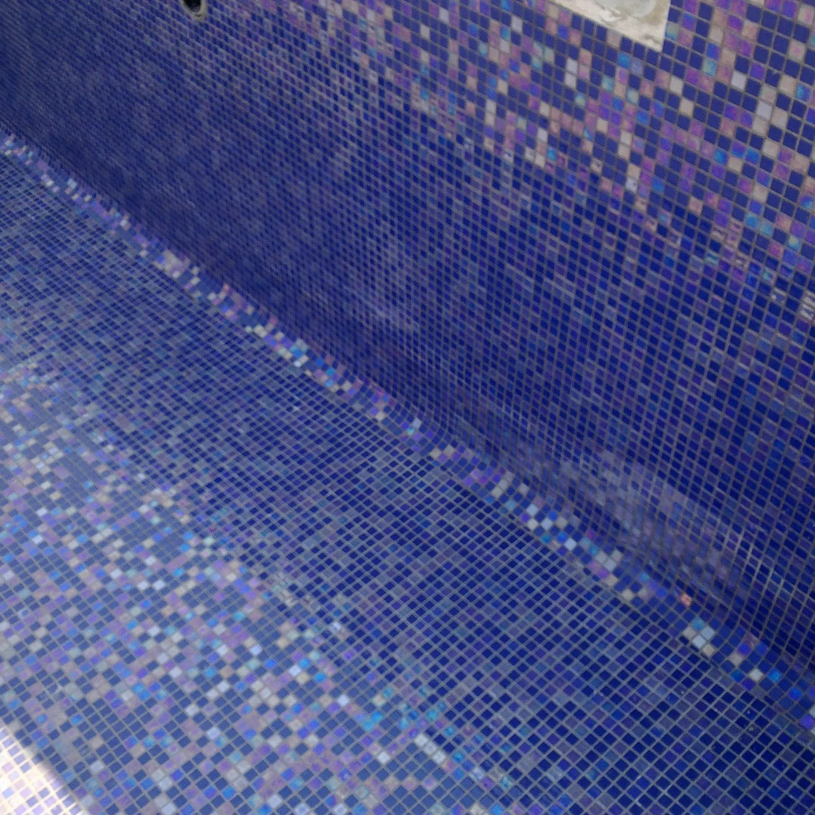 Abalon Azure blue glass mosaic tiles in a bathroom setting