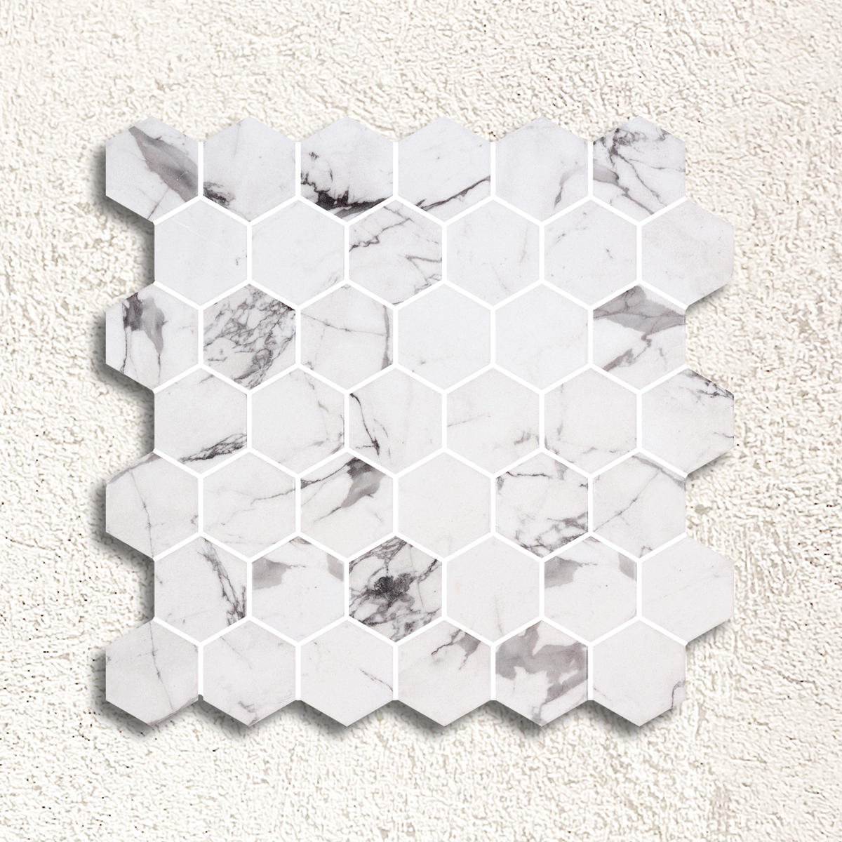 White hexagonal marble mosaic tile with subtle gray veining in hex xl fosco matte mosaic design
