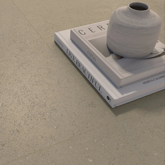 Osso Sand beige brushed stone-effect porcelain tiles in a room setting