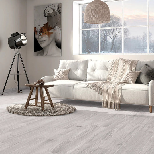 Aire Blanco 20x120cm pale grey wood effect porcelain plank flooring in a room setting