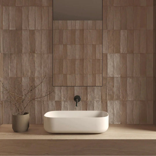 Terra Clay 6 x 24.6cm porcelain zellige-look tiles in a styled room setting