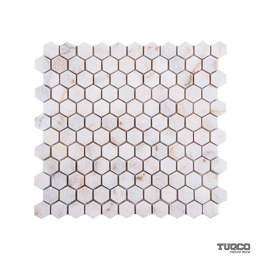 Calacatta Sugar tumbled marble hexagon mosaic sheet in bright white with honeyed gold veining