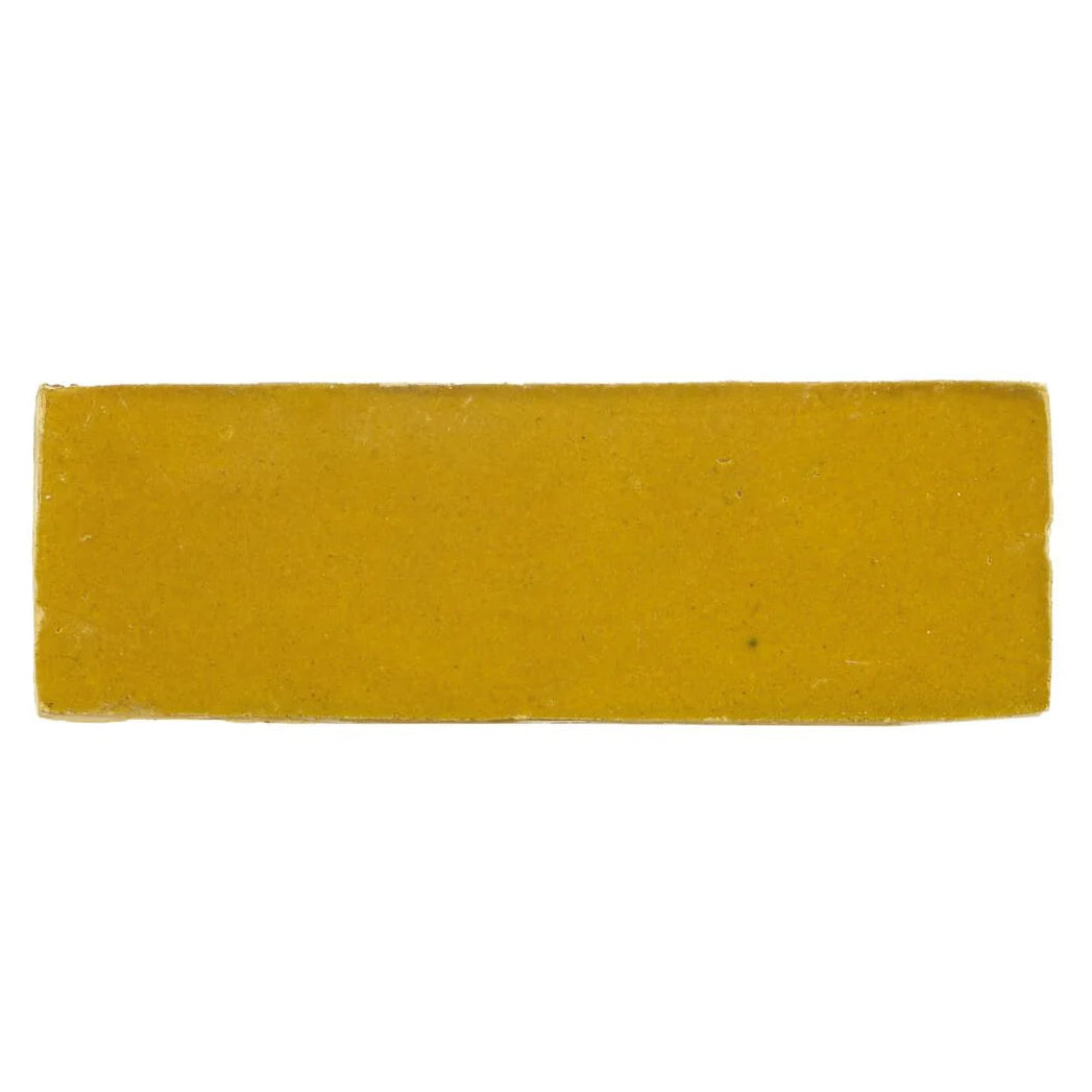 Medina ochre rectangle handmade moroccan zellige tile featuring a solid yellow rectangular bar of soap with textured surface
