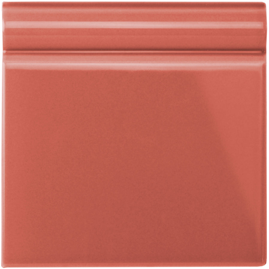 Duchy pink skirting tile ceramic with smooth glossy terracotta finish and subtle horizontal ridges on top edge
