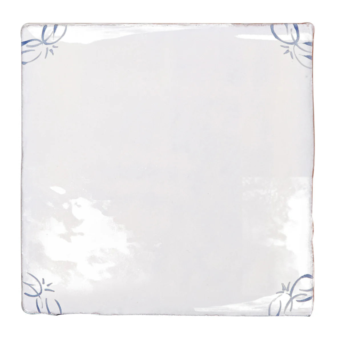 English delft blue gloss corner tile in white ceramic with delicate blue floral motifs in each corner