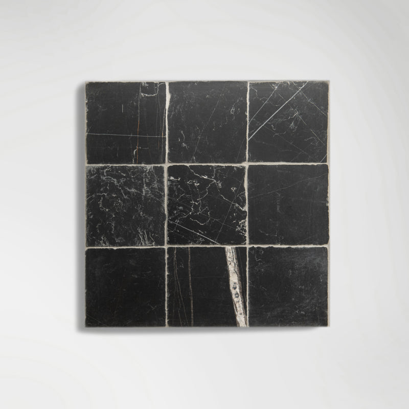 Detail of natural veining across Sahara Noir marble tiles