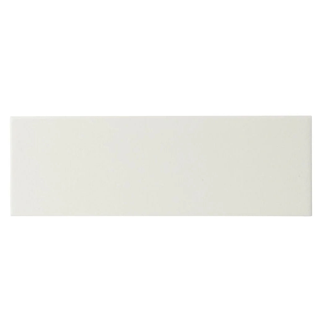 Off-white rectangular ceramic tile with a smooth glossy finish from retro metro south kensington 10 x 30 glazed tile collection