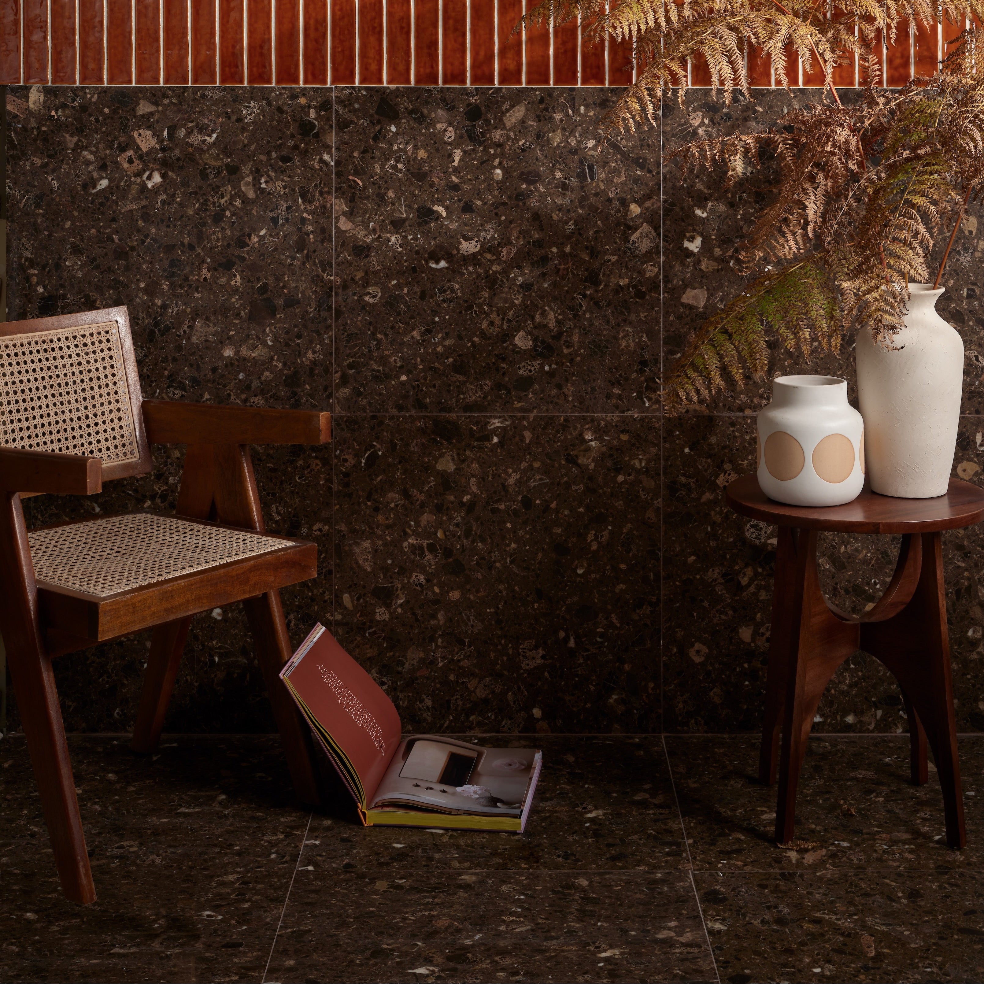 Dark brown rialto terrazzo ca’doro honed wall tiles with speckled stone texture and subtle metallic flecks