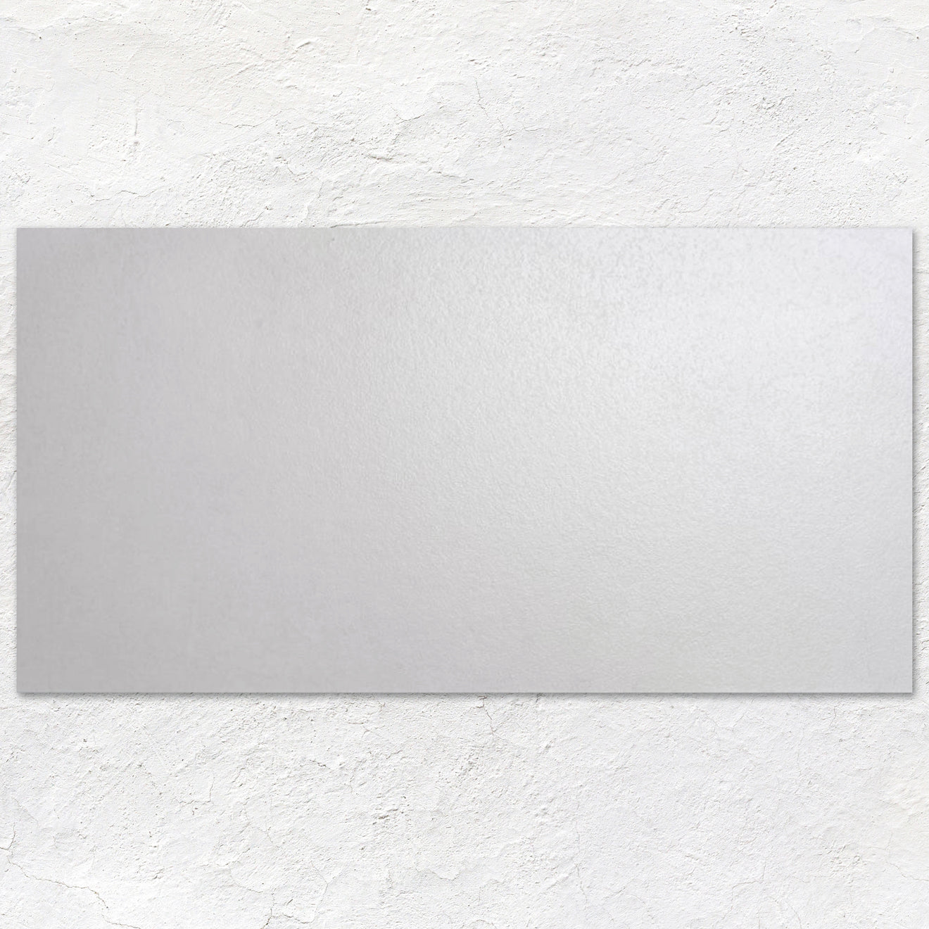 A sleek rectangular mirror with a smooth matte silver finish from rush white 60x30cm collection