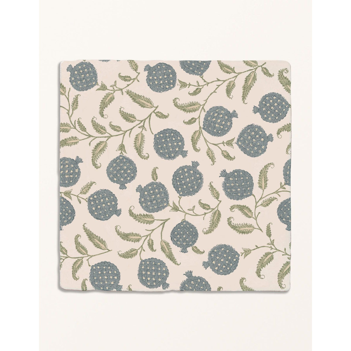 STUDIO Sanderson Anaar Pottery Blue ceramic tile with a blue pomegranate motif on cream