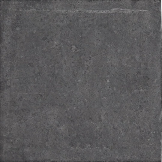 Urban charcoal plain porcelain tile in dark gray with a rough textured surface and subtle tonal variations