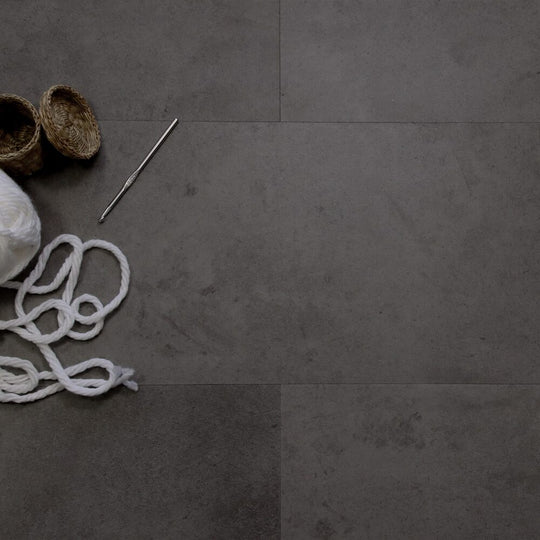 Whitby Charcoal waterproof stone-design tile flooring in a room setting