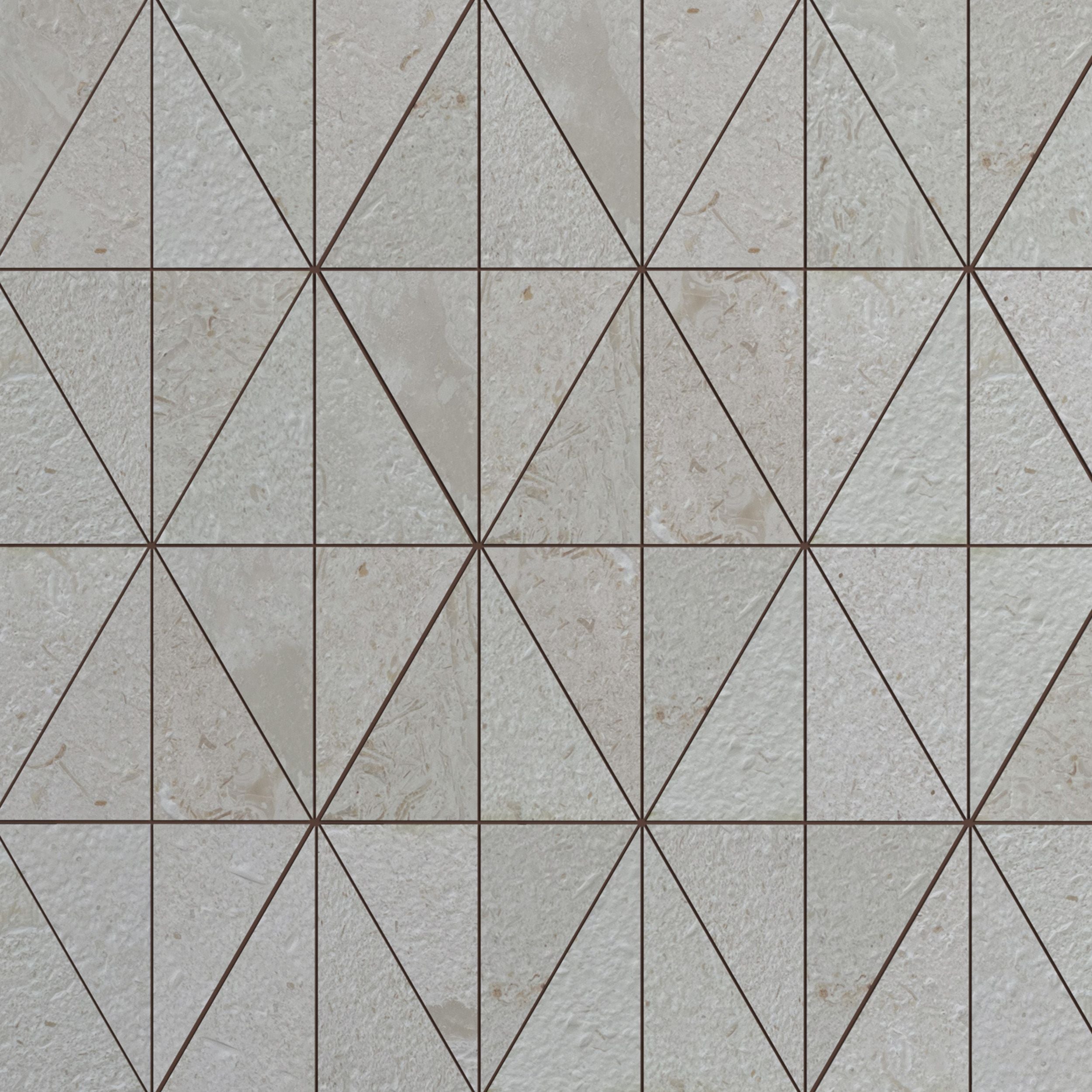 Full sheet of Shellstone brushed limestone triangle mosaic laid flat