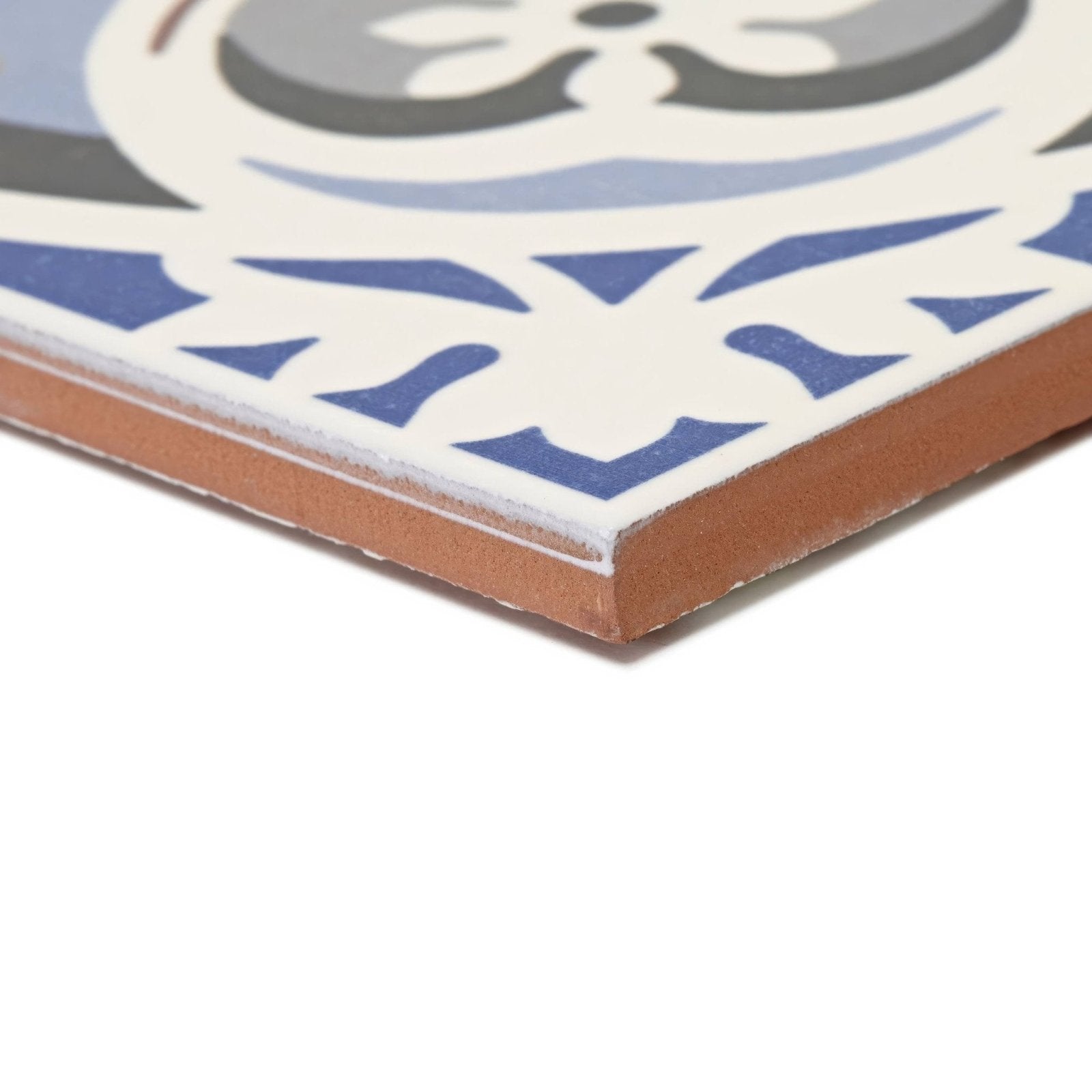 Abbey fountains patterned tile featuring blue and gray ornate ceramic design with terracotta edge