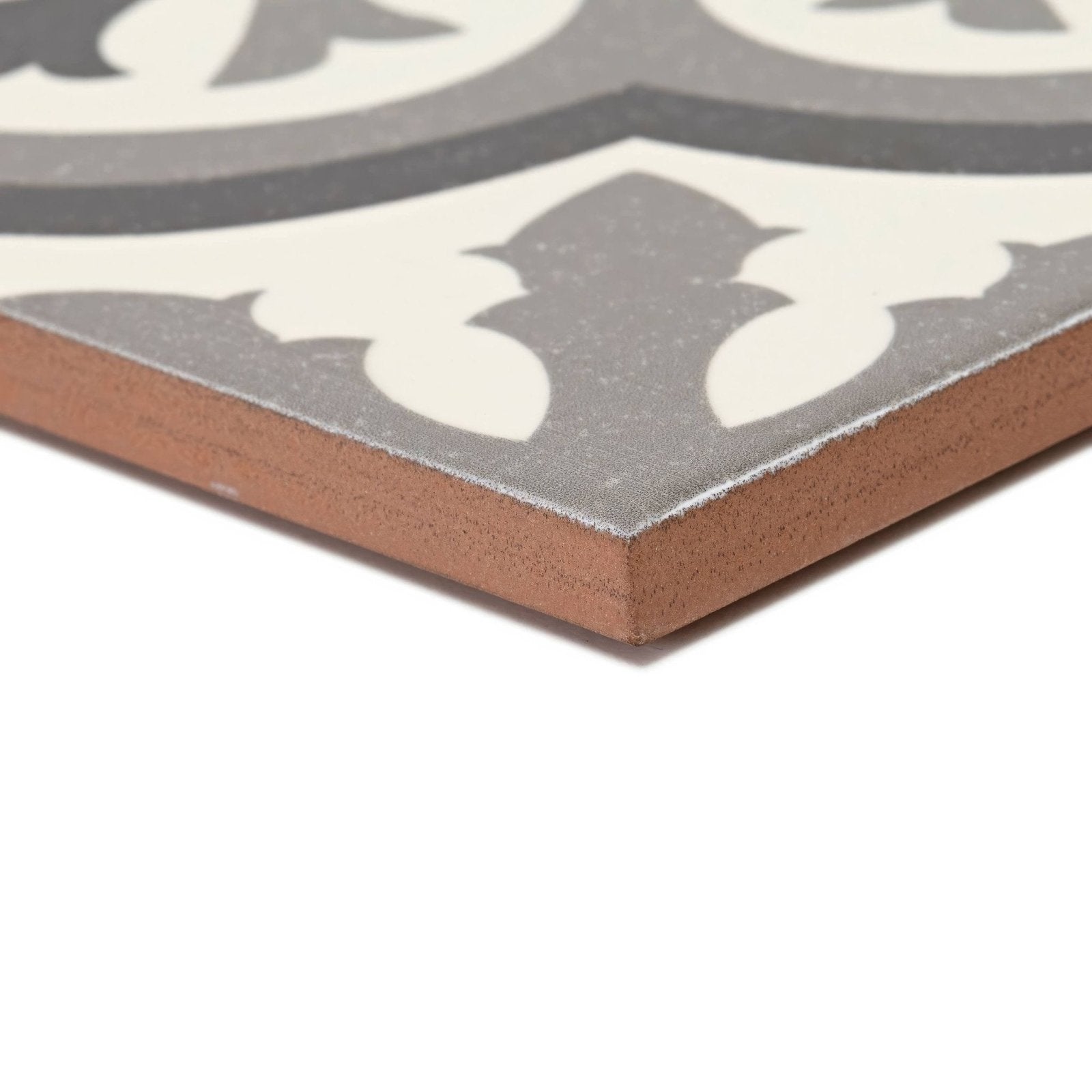 Abbey Waverley patterned ceramic tile featuring gray and white design with a rustic brown edge for decorative use