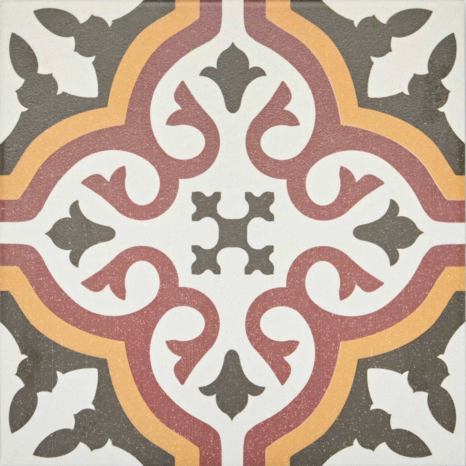 Abbey Whitby patterned tile featuring a square mosaic with maroon mustard yellow and dark gray swirls on white background