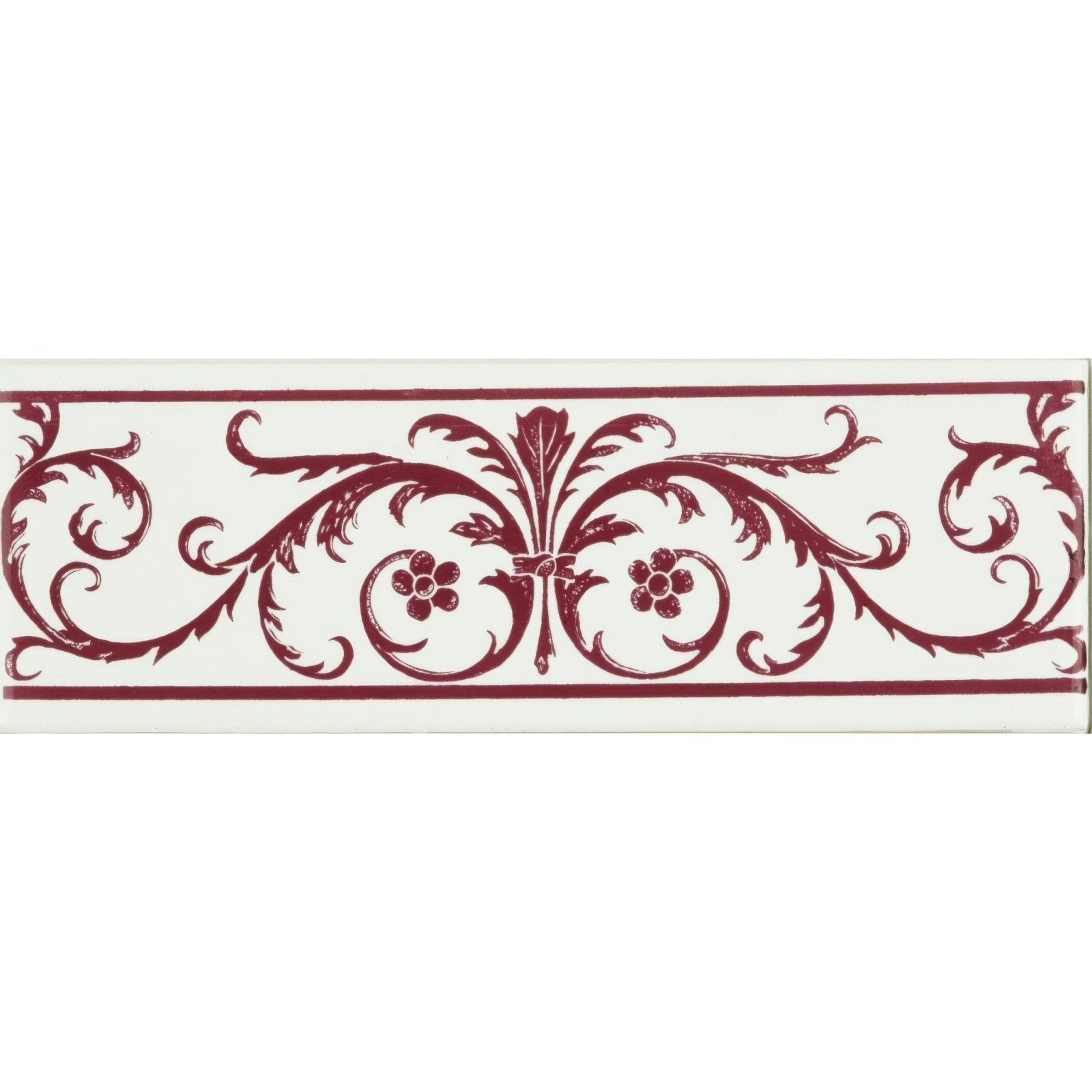 A rectangular ceramic tile with a white background and intricate burgundy acanthus floral and scrollwork design