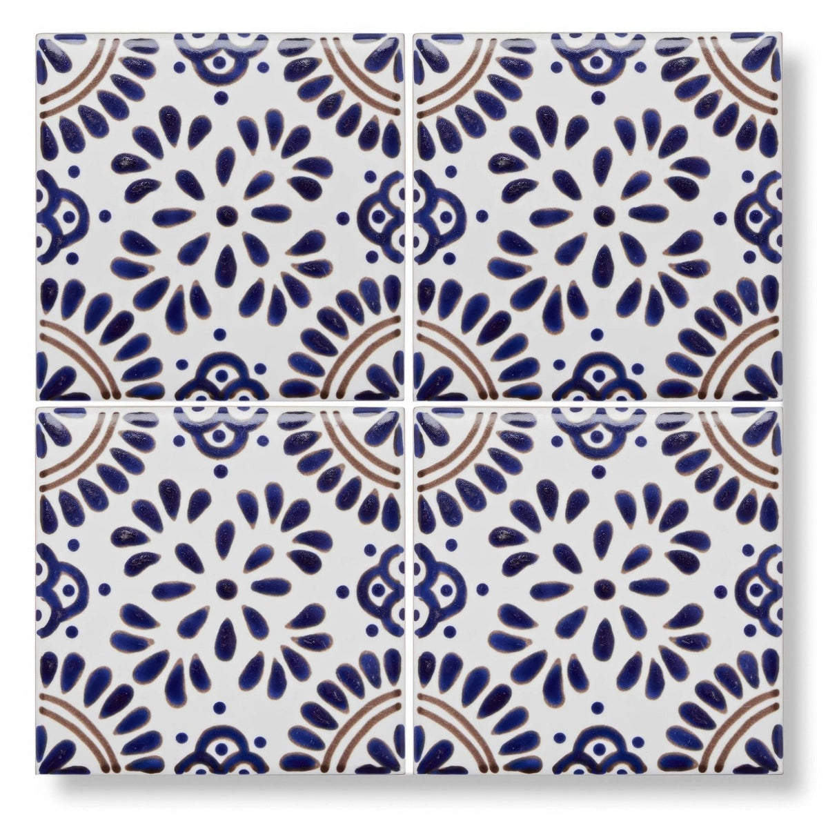 White ceramic acapulco lozano 10x10cm tile with intricate blue and brown floral patterns
