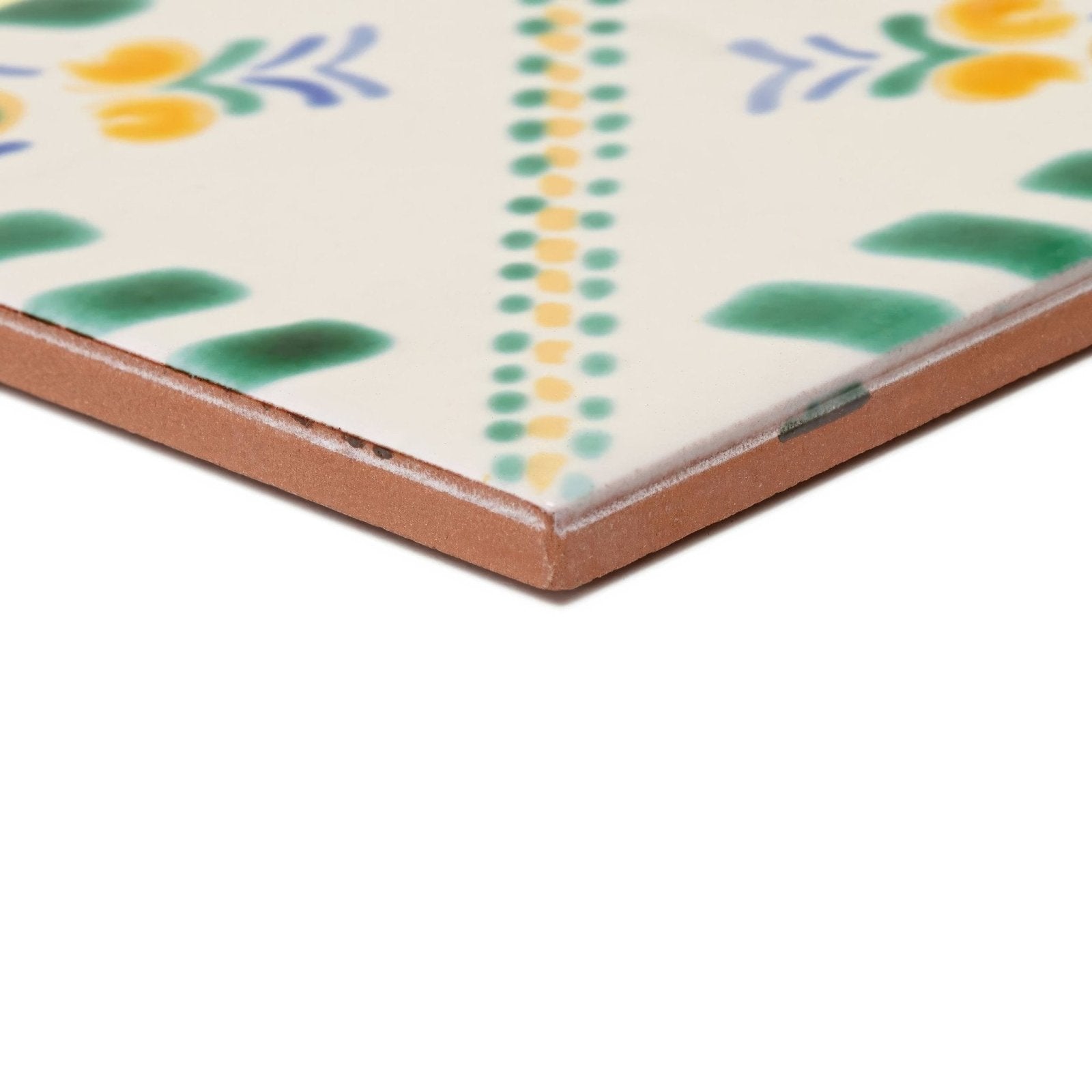 Acapulco Merida 10x10cm ceramic tile with cream surface and hand-painted green yellow and blue floral and dotted patterns
