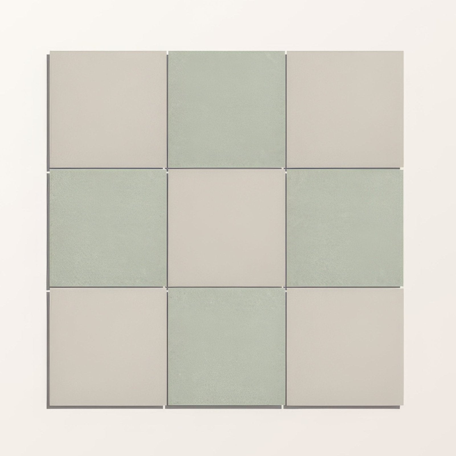 Nine adventuras olive field porcelain tiles in muted sage green and soft beige with smooth matte finish arranged in a grid