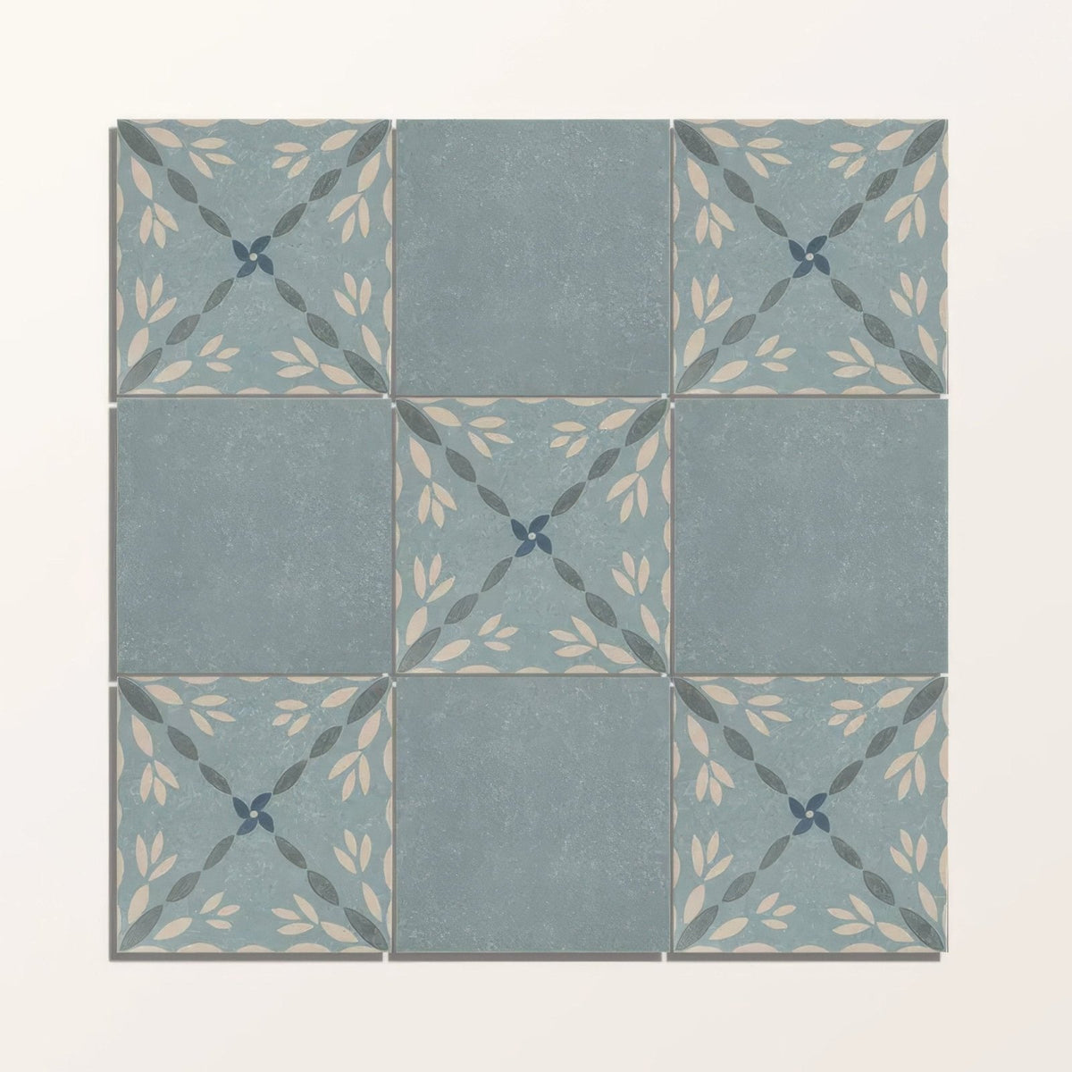 Adventuras porto blue porcelain square ceramic tiles with muted blue-gray base and cream dark green leaf patterns