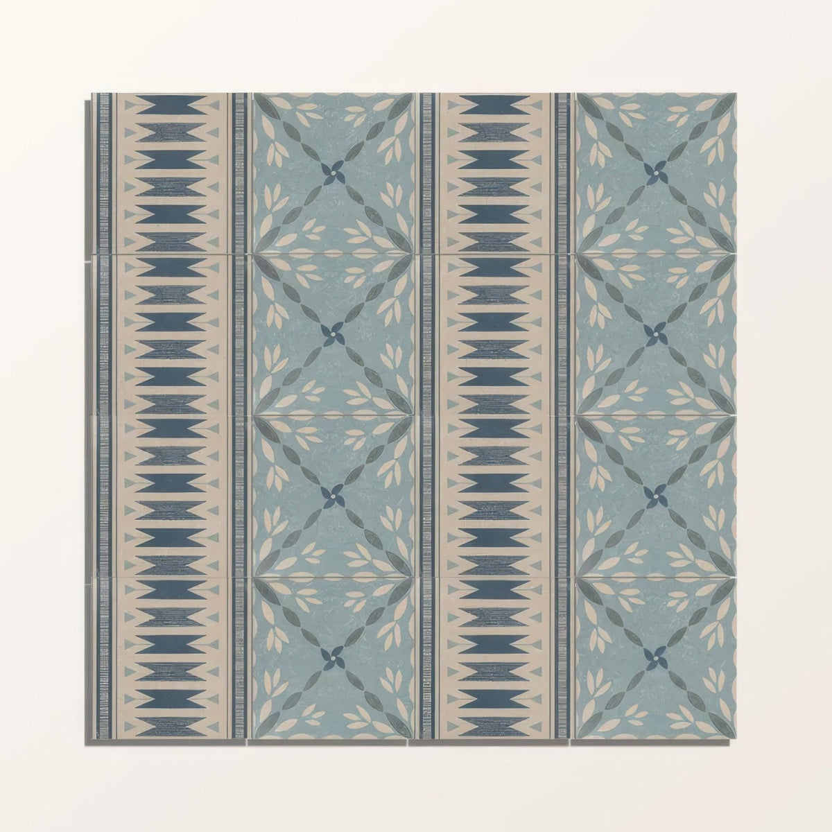 Set of four vintage-style adventuras ziggy border blue porcelain floor tiles with muted blue and beige geometric leaf patterns