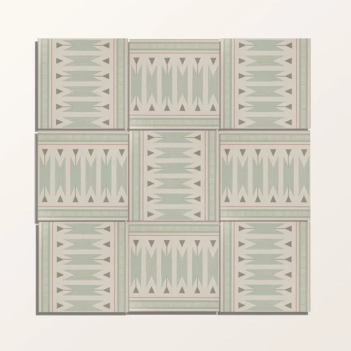 Set of nine Adventuras Ziggy Border Olive porcelain tiles with muted sage green and cream geometric triangular patterns