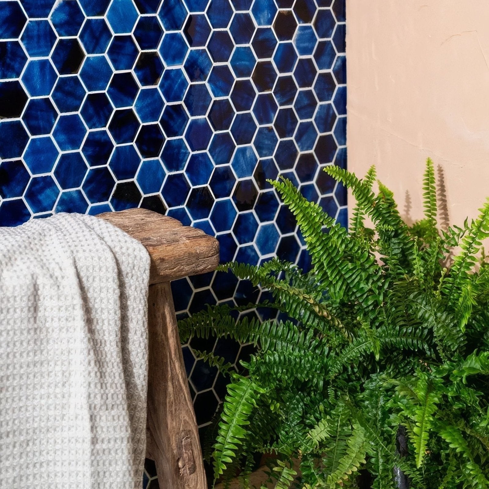 Akazu Porcelain Cobalt Mosaic deep blue hexagonal porcelain mosaic tiles styled with a green fern