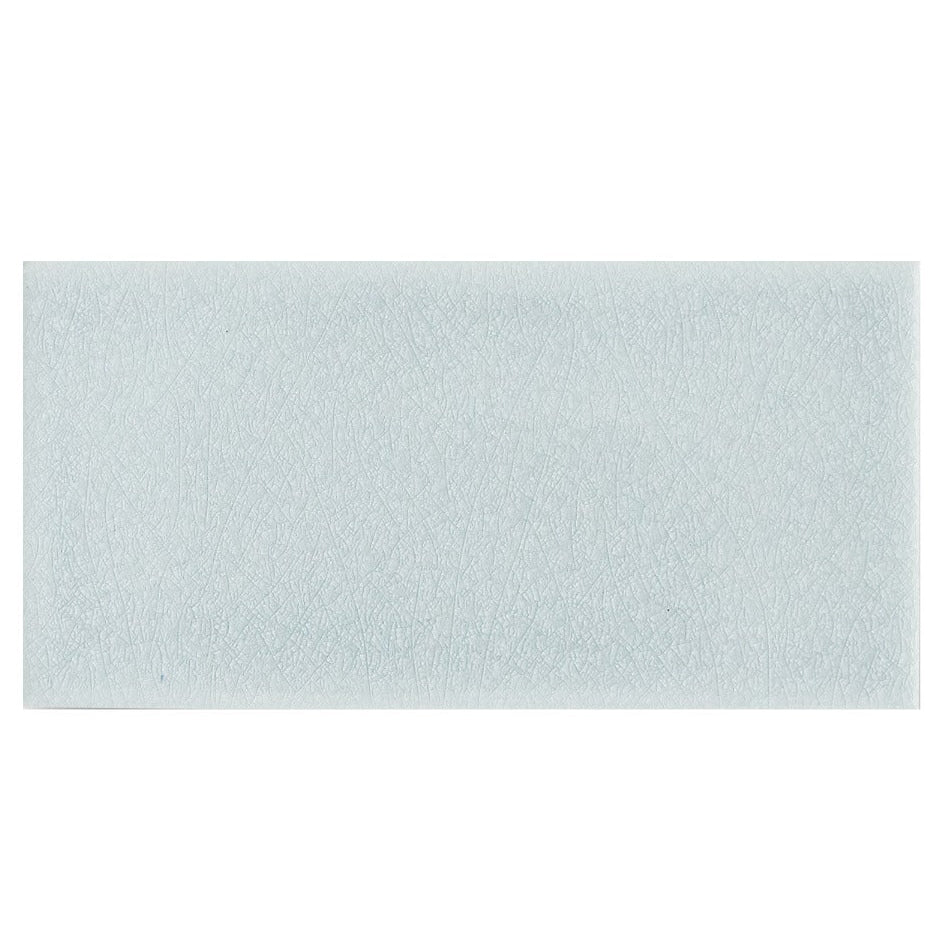 Light blue rectangular glazed tile with subtle textured surface alhambra blue 7.5 x 15 inches