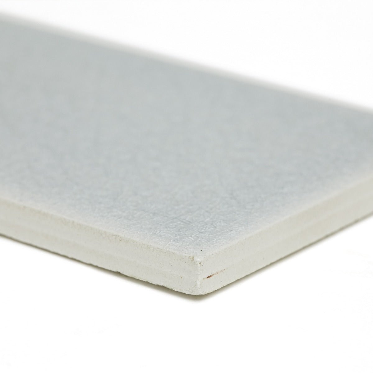 Light gray rectangular alhambra blue 7.5 x 15 matte textured glazed tile with clean white edges