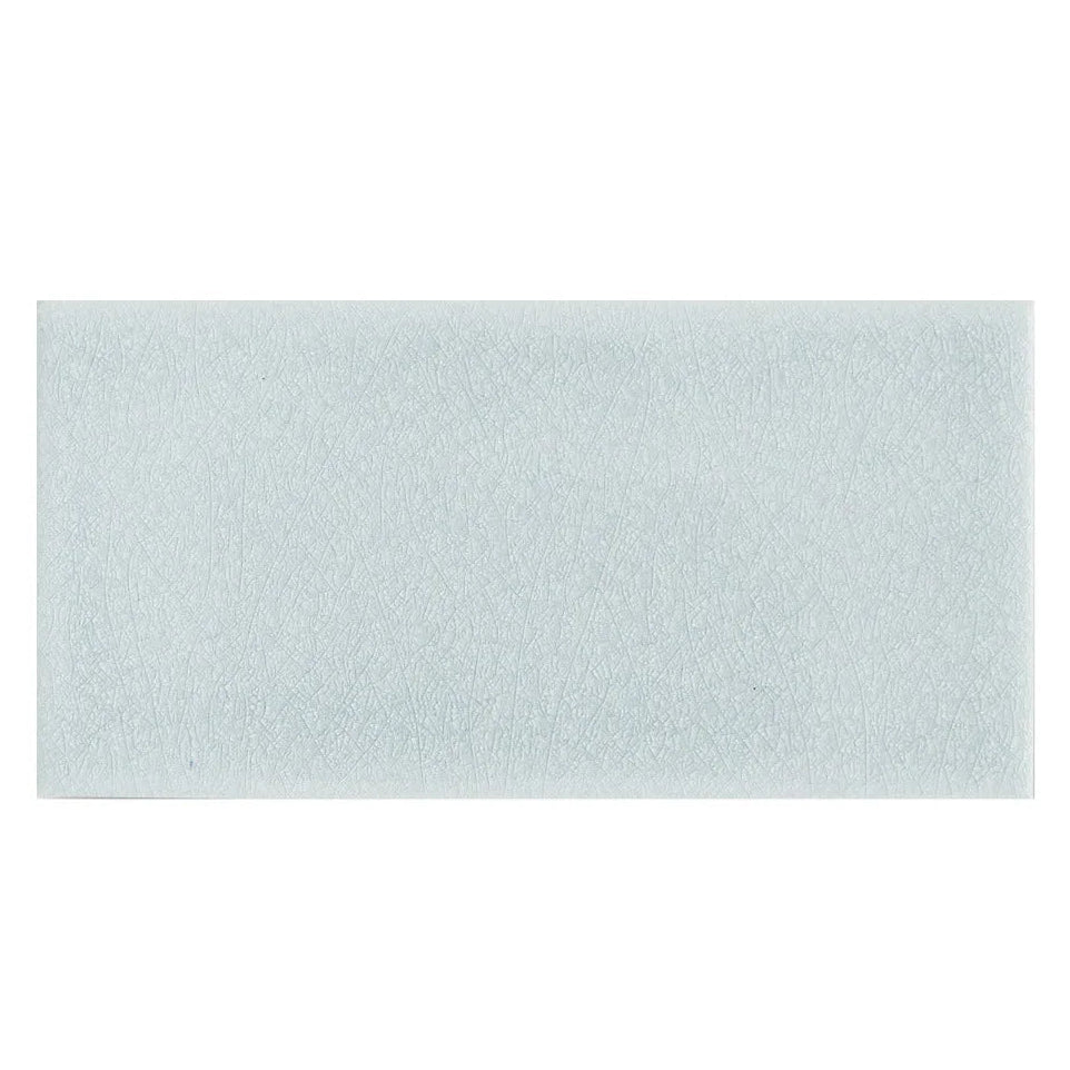 Alhambra Blue 7.5 x 15 rectangular glazed tile in light blue with a textured frosted finish for wall applications
