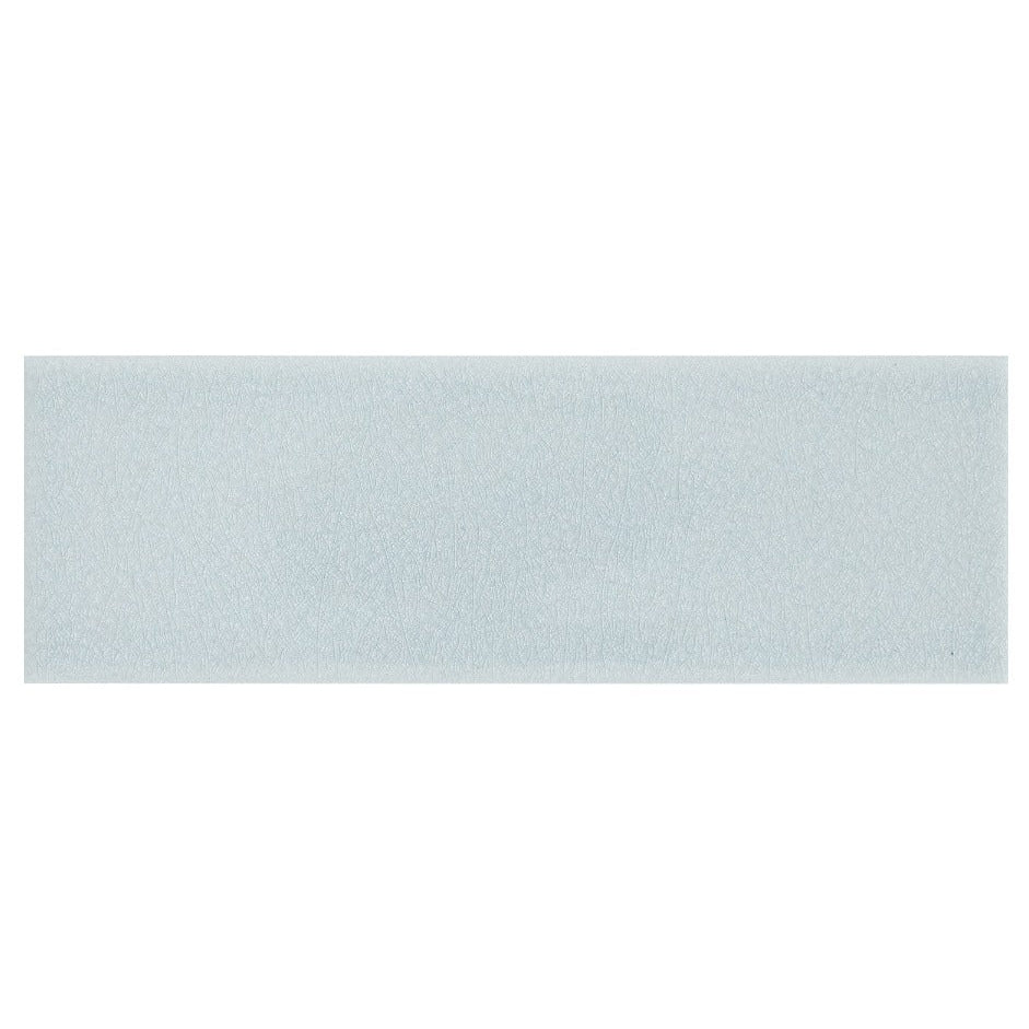 Alhambra blue 7.5 x 22.5 rectangular glazed ceramic tile with matte finish and subtle textured light blue surface