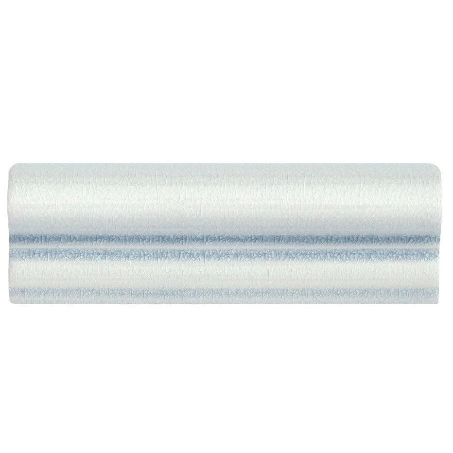 A cylindrical roll of light blue textured fabric with subtle horizontal stitching for Alhambra blue glazed dado tiles