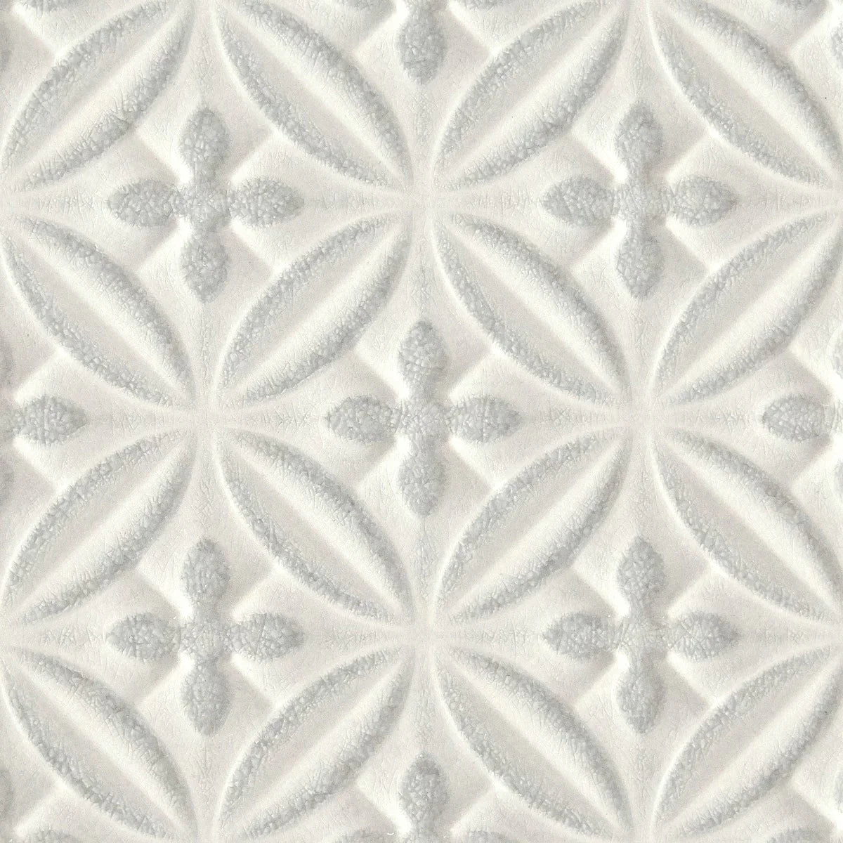 Alhambra Grey Decor Glazed Tile white textured glazed tile with embossed quatrefoil and leaf motifs