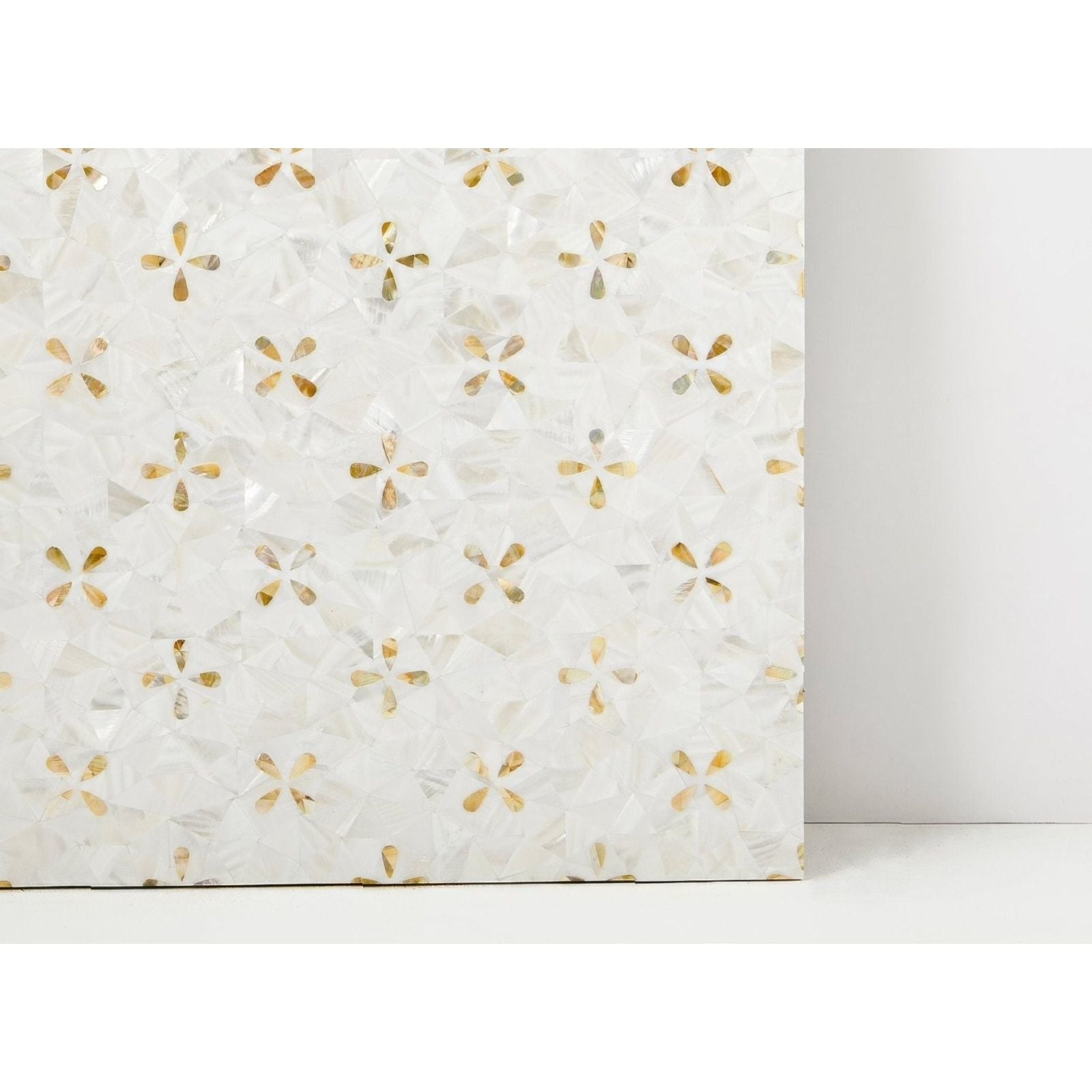 Alpine Golden Promise white and gold mosaic tile panel with small four-petaled mother-of-pearl flower inlays