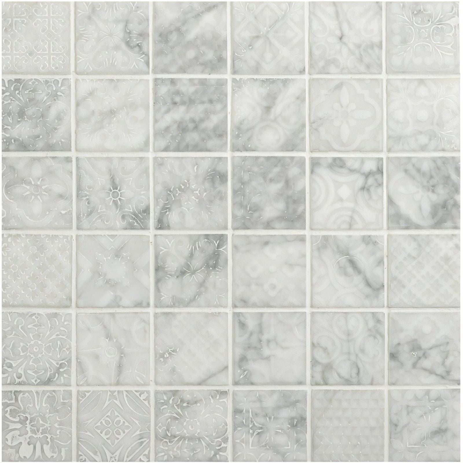 Alto white marble patterned mosaic tile with subtle gray veining and decorative etched designs on white marble