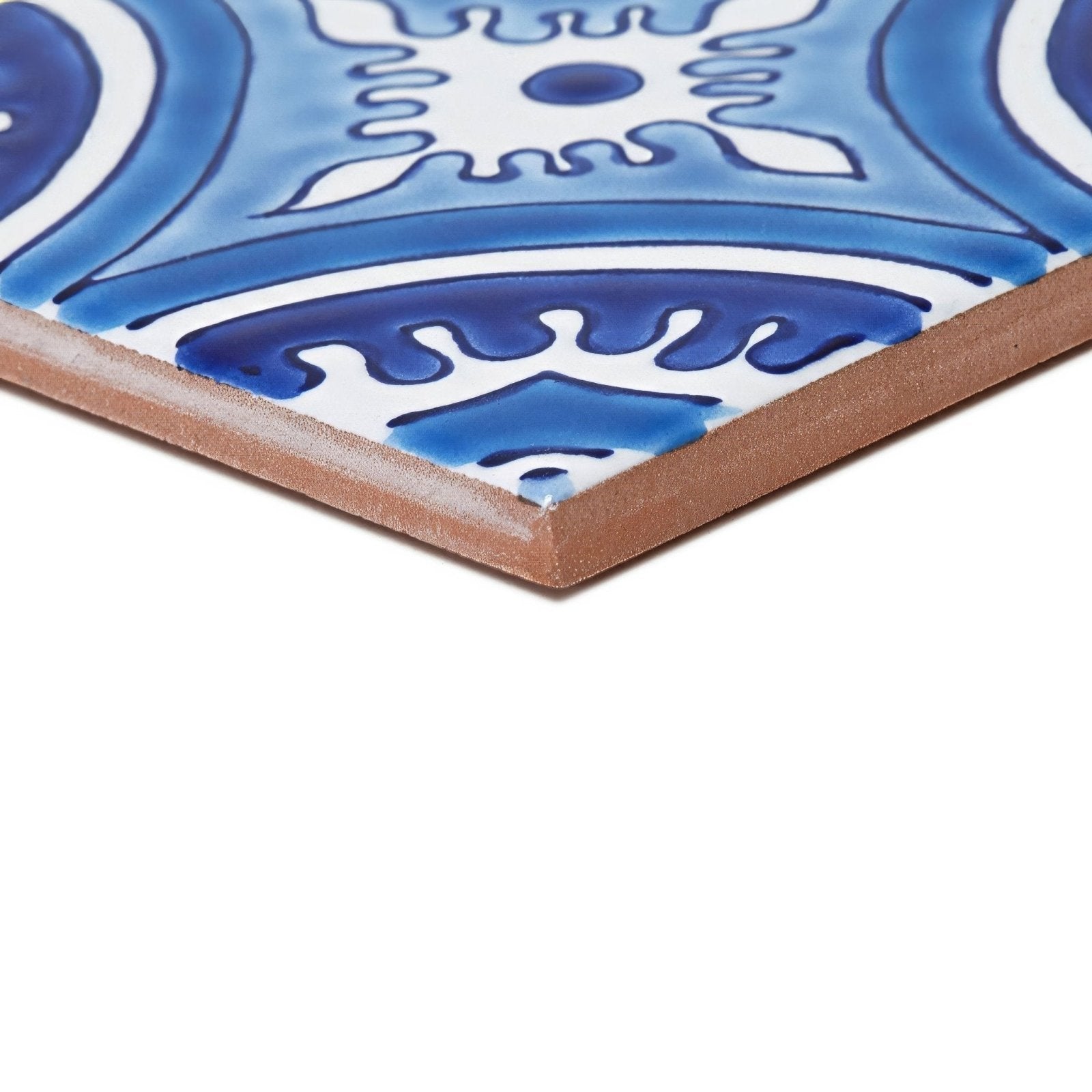 Blue and white ceramic tile with intricate swirling patterns from the Andalucia Hacienda patterned tile collection